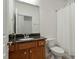 Bathroom features a vanity with granite counters, stainless faucet, and a shower with a white curtain at 241 Lifeson Way, Cary, NC 27519