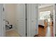 Bedroom with hardwood floors features a large window and a neutral color palette at 241 Lifeson Way, Cary, NC 27519
