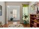 Inviting entryway with hardwood floors, tasteful decor, and an open doorway at 241 Lifeson Way, Cary, NC 27519