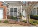 Inviting exterior with manicured landscaping and a birdbath, complemented by stylish siding and brick accents at 241 Lifeson Way, Cary, NC 27519