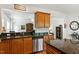 Spacious kitchen boasts granite countertops, stainless steel appliances, custom cabinets, and an island with a sink at 241 Lifeson Way, Cary, NC 27519