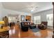 Bright, open living space featuring hardwood floors and a view into the dining area at 241 Lifeson Way, Cary, NC 27519