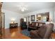 Bright living room with hardwood floors and a comfortable seating arrangement at 241 Lifeson Way, Cary, NC 27519