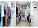 Walk-in closet with custom shelving provides ample storage for clothes, shoes, and accessories at 2436 Fiddich Ln, Fuquay Varina, NC 27526