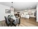 Open concept dining room flows into kitchen, perfect for entertaining with island seating at 2436 Fiddich Ln, Fuquay Varina, NC 27526