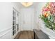 Welcoming foyer featuring wood-look flooring, natural light, and stylish decor at 2436 Fiddich Ln, Fuquay Varina, NC 27526