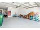 Spacious garage features clean, epoxy floors and ample storage space for cars and belongings at 2436 Fiddich Ln, Fuquay Varina, NC 27526