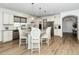 Spacious kitchen featuring a large island, stainless steel appliances, and wood-look floors at 2436 Fiddich Ln, Fuquay Varina, NC 27526