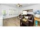 Comfortable living room with shutters, hardwood floors and contemporary decor at 2436 Fiddich Ln, Fuquay Varina, NC 27526