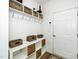 Mudroom with hooks, storage shelves and baskets offers a convenient drop zone by the door at 2436 Fiddich Ln, Fuquay Varina, NC 27526