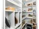 Organized walk-in pantry with shelving, baskets, and storage containers at 2436 Fiddich Ln, Fuquay Varina, NC 27526