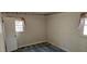 Inviting bedroom featuring striped wallpaper, plush carpeting, and natural light at 319 Davis Rd, Hillsborough, NC 27278