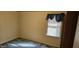 Cozy bedroom featuring patterned wallpaper, plush carpeting, and a bright window at 319 Davis Rd, Hillsborough, NC 27278