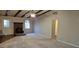 Bright living room with a wood-burning stove, ceiling fan, and access to the outdoors at 319 Davis Rd, Hillsborough, NC 27278