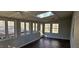 Sunroom featuring a ceiling fan, a skylight, and multiple windows providing abundant natural light at 319 Davis Rd, Hillsborough, NC 27278