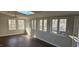 Bright sunroom filled with natural light from multiple windows and skylight at 319 Davis Rd, Hillsborough, NC 27278