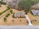 Aerial of a home with manicured landscaping and mature trees, showcasing its curb appeal at 4017 Olde Waverly Way, Fuquay Varina, NC 27526
