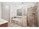 Bright bathroom features soaking tub, glass shower, and tiled surround at 4017 Olde Waverly Way, Fuquay Varina, NC 27526