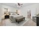 Relaxing bedroom with ensuite bathroom featuring modern furnishings and neutral color palette at 4017 Olde Waverly Way, Fuquay Varina, NC 27526