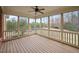 Large screened porch showcasing views of the spacious backyard and wooded area at 4017 Olde Waverly Way, Fuquay Varina, NC 27526