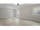 Minimalist bedroom with hardwood floors, natural light, and neutral color scheme at 4307 Pope Rd, Durham, NC 27707
