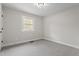 Carpeted bedroom featuring a bright window at 4307 Pope Rd, Durham, NC 27707