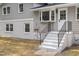 Gray home featuring painted brick and dark railings at 4307 Pope Rd, Durham, NC 27707
