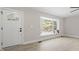 Inviting living room featuring a bay window, hardwood floors, and a front door at 4307 Pope Rd, Durham, NC 27707