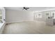 Open-concept living area with hardwood floors and plenty of natural light at 4307 Pope Rd, Durham, NC 27707