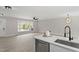 Open-concept living room with a large picture window and modern finishes throughout at 4307 Pope Rd, Durham, NC 27707