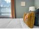 Cozy bedroom featuring a decorative pillow and natural light from the window at 449 Parnell Dr, Raleigh, NC 27610