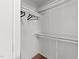 Walk-in closet provides ample storage space with shelves and hanging rods at 449 Parnell Dr, Raleigh, NC 27610