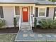 Charming home featuring a bright red front door with a gray exterior at 449 Parnell Dr, Raleigh, NC 27610