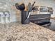 Close up of modern kitchen featuring granite countertop and stainless steel oven at 449 Parnell Dr, Raleigh, NC 27610