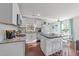 Bright, updated kitchen features granite countertops, stainless appliances, and a center island at 449 Parnell Dr, Raleigh, NC 27610
