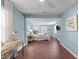 Spacious main bedroom includes hardwood floors, a ceiling fan, and room for a sitting area at 449 Parnell Dr, Raleigh, NC 27610