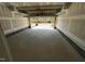 Empty two car garage, freshly painted, with open garage door at 526 Billingshurst Way # 211, Knightdale, NC 27545