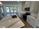 Kitchen island with quartz countertops and stainless steel appliances at 526 Billingshurst Way # 211, Knightdale, NC 27545