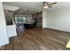 Open-concept living room and kitchen with hardwood floors and stainless steel appliances at 526 Billingshurst Way # 211, Knightdale, NC 27545