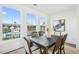 Dining room with large windows offering great views and a dark wood dining set at 526 Billingshurst Way, Knightdale, NC 27545