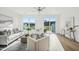 Open-concept living room features hardwood floors, contemporary furnishings, and natural light from windows at 526 Billingshurst Way, Knightdale, NC 27545