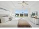 Bright main bedroom with tray ceilings, large windows, and neutral decor at 526 Billingshurst Way, Knightdale, NC 27545