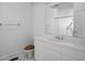Clean, bright bathroom featuring a sleek vanity, mirror, and modern fixtures at 595 Weathersfield # A, Pittsboro, NC 27312