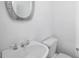 Bright bathroom with a white sink, toilet, and modern fixtures and mirror at 595 Weathersfield # A, Pittsboro, NC 27312