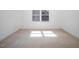 Bedroom featuring carpeted floor and natural light from window at 595 Weathersfield # A, Pittsboro, NC 27312