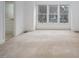 Bright bedroom featuring a large window with views of the surrounding neighborhood at 595 Weathersfield # A, Pittsboro, NC 27312