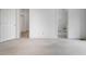 Bright bedroom with carpeted floors and doorway to bathroom and walk-in closet at 595 Weathersfield # A, Pittsboro, NC 27312