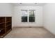 Well-lit bedroom with built-in bookshelf at 595 Weathersfield # A, Pittsboro, NC 27312