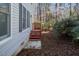 Exterior view of the home with wood siding and stairs to the backyard at 595 Weathersfield # A, Pittsboro, NC 27312