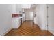 Open kitchen with white cabinets, red backsplash, and ample counter space at 595 Weathersfield # A, Pittsboro, NC 27312